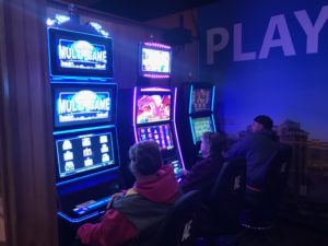 Customers playing slot machines at Kep's Sports Bar & Grill in Washington, Illinois